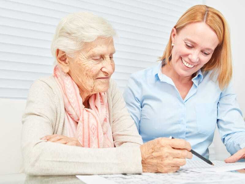 caregiver assisting memory care resident