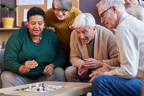 group-senior-people-playing-board-games-together